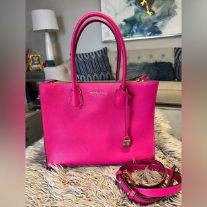 Hot Pink Michael Kors Handbag with shoulder strap included.